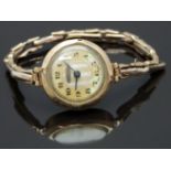 Swiss 9ct gold ladies wristwatch with blued hands, black Arabic numerals, mother of pearl chapter