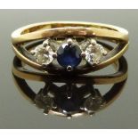 An 18ct gold ring set with a sapphire and two diamonds, each approximately 0.18ct, 5g, size N