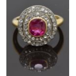 Victorian 18ct gold ring set with a cushion cut pink sapphire surrounded by two tiers of old cut