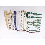 A group of necklaces including lapis lazuli, two malachite, garnet, pearl and filigree made up of