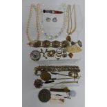 A collection of costume jewellery including brooches, Victorian brooch, locket, medallion, etc