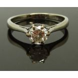 A platinum ring set with a round cut diamond of approximately 0.55ct, size K/L, 2.62g