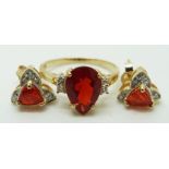 A 9ct gold ring set with a pear cut Queretaro cherry fire opal and white sapphires, and a pair of