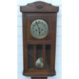 Oak cased c1910 two train wall clock with bevelled glass panels, height 78cm