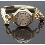 Winegartens 9ct gold ladies wristwatch with gold hands and Arabic numerals, silver dial, octagonal