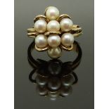 A 9ct gold ring set with pearls, size J, 5.11g