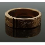 Victorian mourning ring with chased foliate decoration, opening to reveal a hollow section