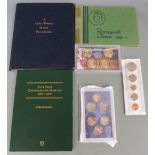 A collection of various USA coin packs to include Roosevelt dimes, Presidential History set etc