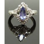 A 14ct white gold ring set with a marquise cut amethyst and diamonds, size K, 4.00g