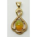 A 9ct gold pendant set with an Indonesian opal and a diamond, 2.2g