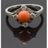A white metal ring set with a coral cabochon and diamonds, size M, 3.54g
