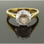 An 18ct gold ring set with a round cut cubic zirconia, size P, 4.65g