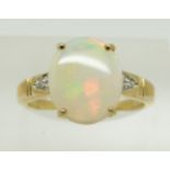 A 9ct gold ring set with an oval opal cabochon and diamonds,2.5g, size N