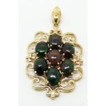 A 9ct gold pendant set with seven oval cut Mezezo opals, 5.3g