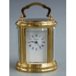 Angelus brass oval cased 20thC carriage clock with French L'Epee II jewel movement, 8cm tall