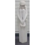 Carved alabaster figurine of a kneeling nude on octagonal plinth, height 106cm