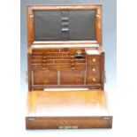 Oak travelling writing slope stationery box, the fold out slope opening to reveal fitted interior