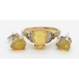 A 9ct gold ring set with a pear cut Indonesian opal and diamonds (size N) and a pair of 9ct white