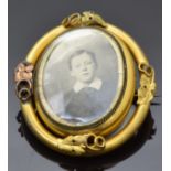 Victorian pinchbeck swivel brooch set with a photograph to one side, verso set with hair, with ivy