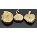 A 9ct gold locket, 9ct gold heart locket and a 9ct back and front locket with engine turned