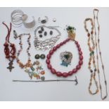 A collection of costume jewellery including beads, silver bracelet, agate necklace, silver Albert,