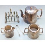 Silver plated tea service comprising teapot, milk jug, sugar, sugar nips and a toast rack
