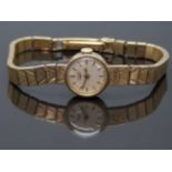 Longines 9ct gold ladies wristwatch with gold hands and baton markers, cream dial and signed 17