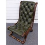 Leather Chesterfield style button backed nursing chair with shaped mahogany frame
