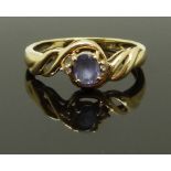 A 14ct gold ring set with a tanzanite and diamonds, size L, 1.89g