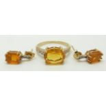 A 9ct gold ring set with an oval cut fire opal and diamonds and a pair of similar earrings, 3.6g,