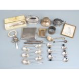 Hallmarked silver items to include cigarette case, two sets of six spoons, napkin ring, mustard with