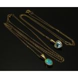 A 9ct gold pendant set with a heart shaped aquamarine and a 9ct gold pendant set with an opal,
