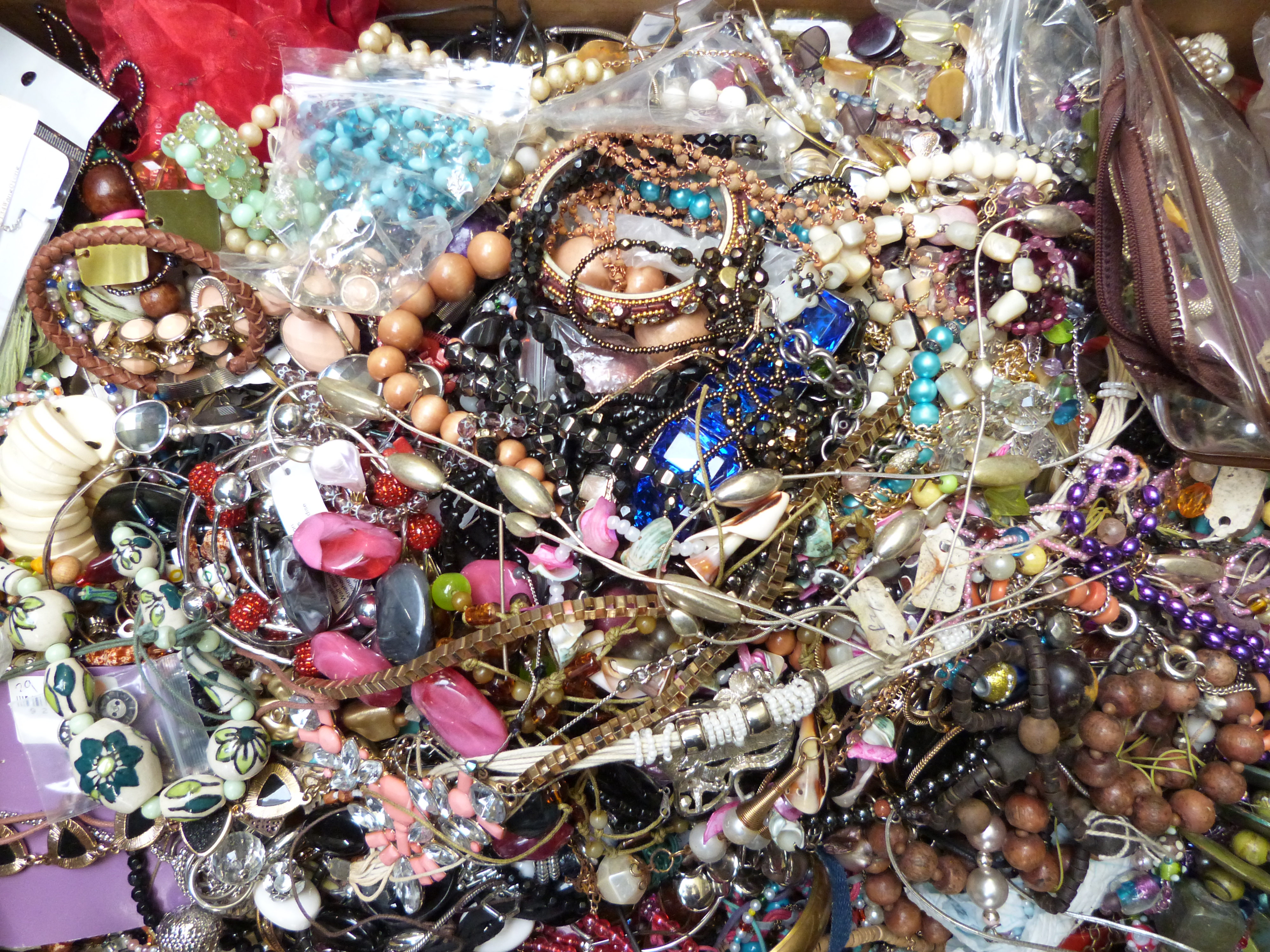 A collection of costume jewellery including beaded necklaces, bangles ...
