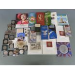 A collection of collectable UK coins, Royal Mint presentation packs and a quantity of modern crowns