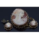 A 9ct gold brooch set with a cameo depicting a young woman (2.7 x 3.5cm) and a pair of 9ct gold