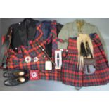A large collection of Scottish national dress including plated sporran, kilts, tweed jacket,