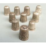 Seven hallmarked silver thimbles, another marked Sterling and two plated thimbles