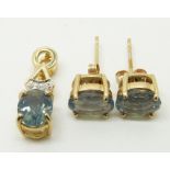 A 9ct gold pendant set with an oval cut blue fire opal and diamonds and a pair of similar