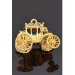 A 9ct gold pendant/charm in the form of a carriage, 5.6g