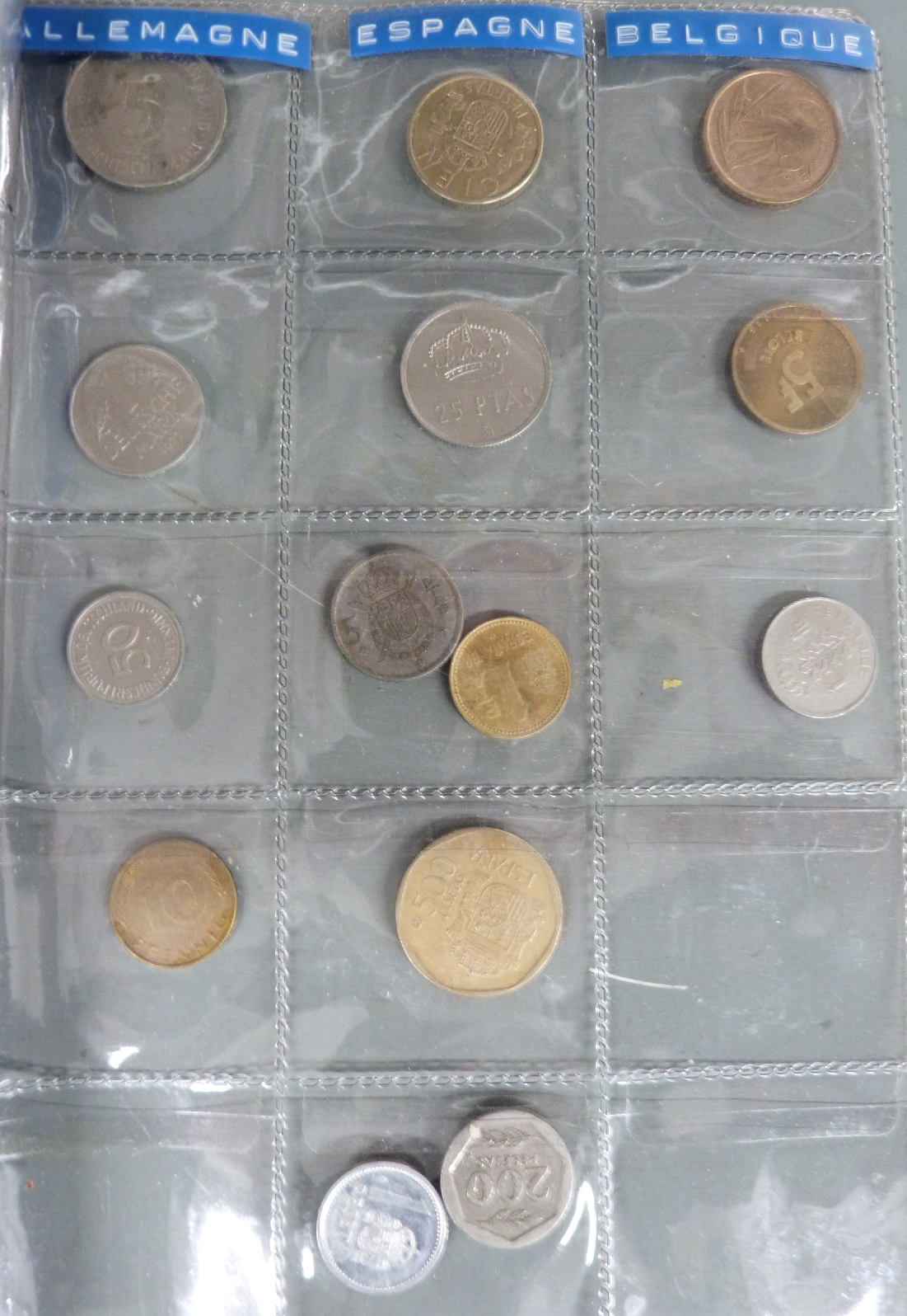 An amateur collection of world coins in an album