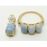 A 9ct gold ring set with three opal cut blue fire opals and diamonds (size N) with matching pendant,