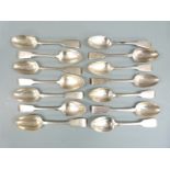 Fourteen 19th century fiddle pattern hallmarked silver fiddle pattern dessert spoons, all but one