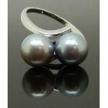 A 14k white gold ring set with two silver pearls, size L, 3.37g