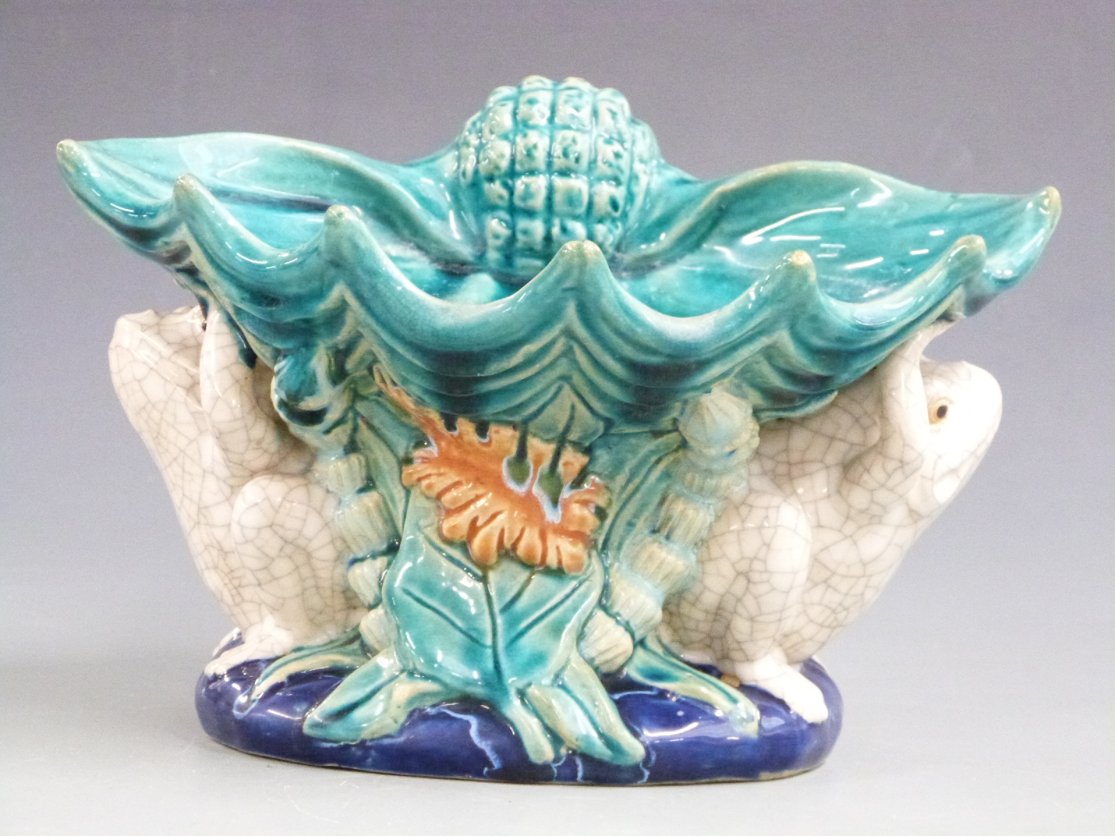 19th/20thC majolica centrepiece in the style of MInton, decorated with two frogs holding a shell