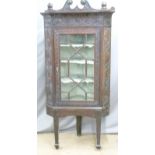 Carved Georgian oak glazed corner cupboard on stand, height 181cm