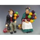 Two Royal Doulton Balloon Man and Woman figures, H 18cm