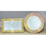 Two Arts and Crafts style bevelled glass mirrors with relief moulded decoration, 51x33cm and