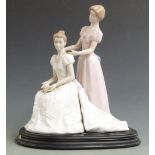 Nadal figural pair of a bride and bridesmaid, on plinth, H 37cm