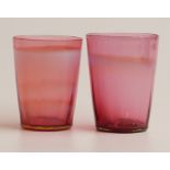 A pair of John Walsh for Powell Glass Company cranberry and blue opalescent glass tumblers, 8.5cm
