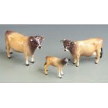 Beswick Jersey cattle, bull, cow and calf, tallest 12cm